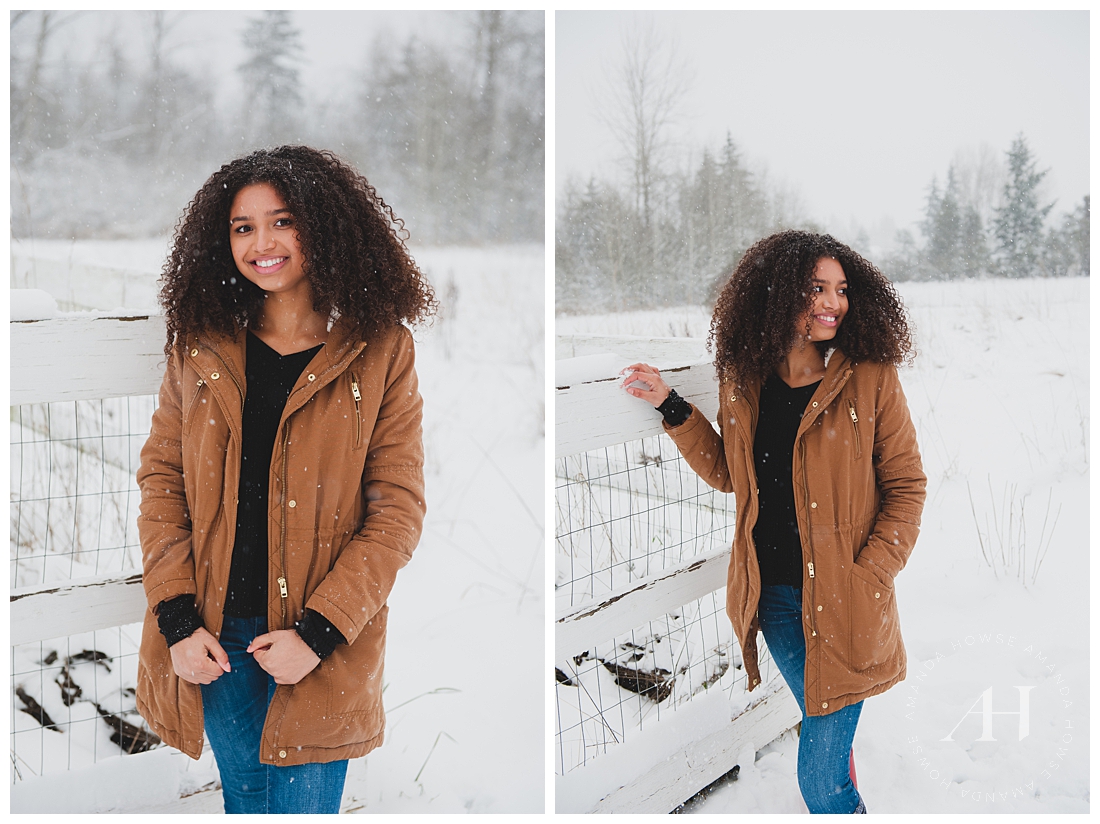 Fun Winter Senior Portraits in the Snow with Long Coat and Jeans Photographed by Tacoma Senior Photographer Amanda Howse