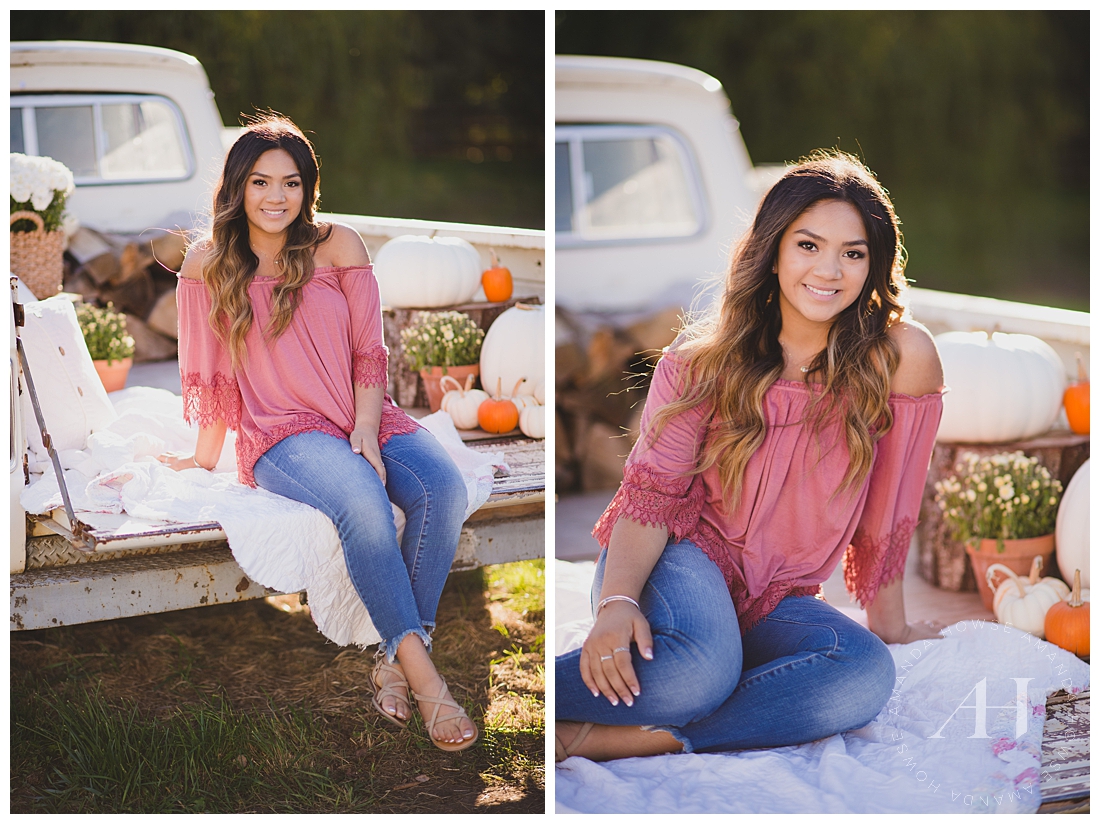 Senior photos in the back of a vintage truck with pumpkins and flowers at Wild Hearts Farm | Photographed by Tacoma Senior Photographer Amanda Howse