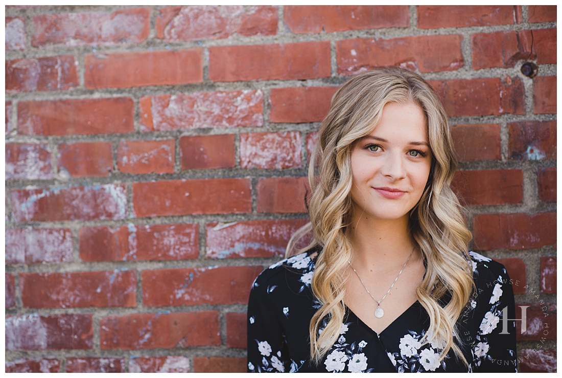 Cute Senior Portrait in Front of A Brick Wall | Photographed by Tacoma Senior Photographer Amanda Howse