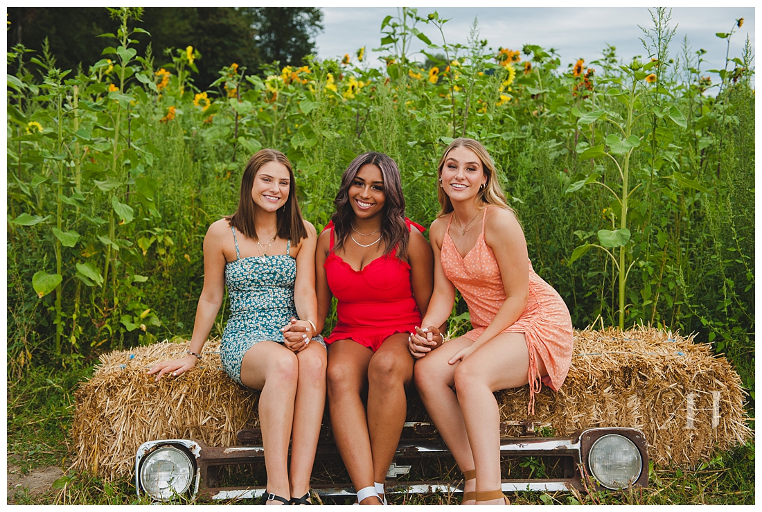 High School Senior Girls on Hay Bales at Pumpkin Farm | Photographed by Tacoma Senior Photographer Amanda Howse