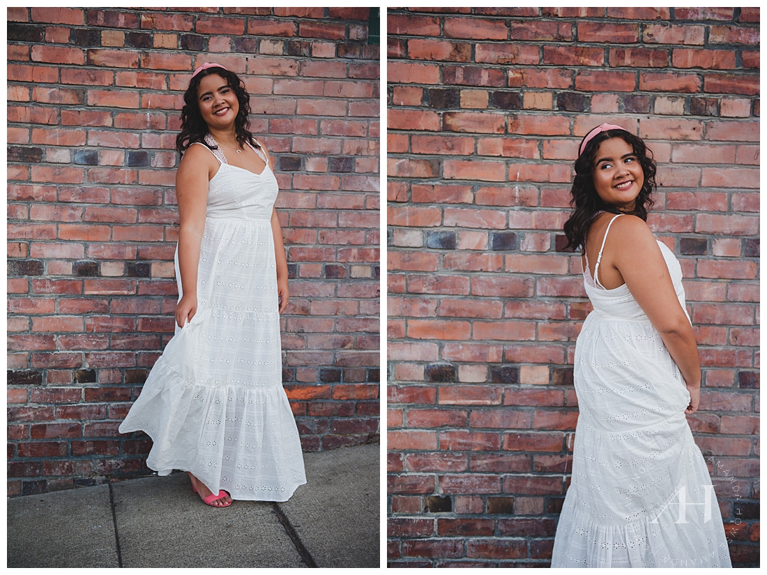 High School Senior Girl in a White Dress in Front of a Brick Wall | Urban Senior Portraits, Fun Senior Photos, Modern Portraits in the City, Outfit Inspiration, How to Accessorize for Senior Portraits | Photographed by the Best Tacoma Senior Portrait Photographer Amanda Howse