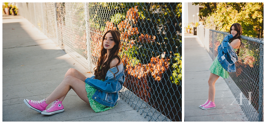 Senior Girl Leaning Against Metal Fence | How to Style an Urban Senior Portrait Session with Cute Dresses and Converse | Photographed by the Best Tacoma Senior Portrait Photographer Amanda Howse